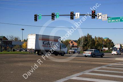 A delivery truck in traffic turning left at an intersection in Boise, Idaho.