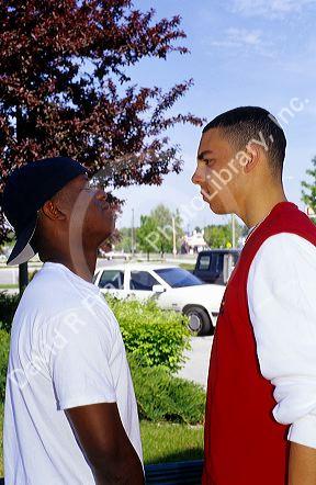Two male teens having a confrontation. MR