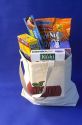 A canvas grocery bag with groceries.