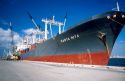 Container ship off loading cargo at Port Everglades, Florida.