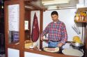 French man making crepes.