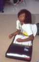 Female African American student studying in an elementary school classroom in Florida.