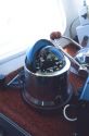 Ship compass on fishing boat.