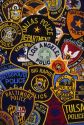A collage of United States police officer shoulder patches.