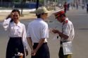 A Saigon police officer writes a ticket, Vietnam.