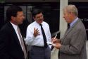 News media reporter interviews businessmen in Boise, Idaho.