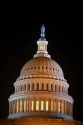 The dome atop the United States Capitol Building at night in Washington DC.