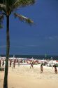 People playing beach volleyball at Ipanema Beach in Rio de Janeiro, Brazil.
