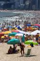 Crowded beach scene at the Copacabana Beach in Rio de Janeiro, Brazil.