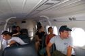 Passengers in a Twin Otter commuter airplane between Moorea and Tahiti in French Polynesia.