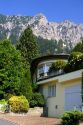 A house in Lichtenstein with the Swiss Alps in the background.