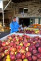 A woman shops for apples at a farmers market in Canyon County, Idaho. MR