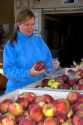 A woman shops for apples at a farmers market in Canyon County, Idaho. MR