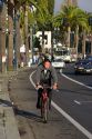 An asian man riding his bicycle in San Francisco, California.