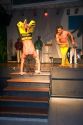 Men perform a martial arts dance called Capoeira at a nightclub in Sao Paulo, Brazil.