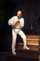 A man plays the tambourine at a nightclub in Sao Paulo, Brazil.