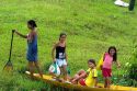 Brazilian girls in a canoe in the Amazon jungle near Manaus, Brazil.