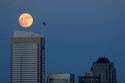Full moon over the city of Seattle, Washington and the Two Union Square Building.