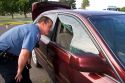 Police officer investigating a car burglary in Oregon.