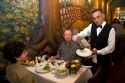 Waiter serving food in a restaurant in Buenos Aires, Argentina.