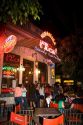 People gather and socialize in front of a bar in Buenos Aires, Argentina.