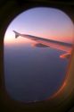 Aerial view of the Andes in Argentina at sunrise through the window of an airplane.
