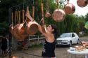 Roadside vendor selling copper pots and pans in rural Chile.