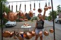 Roadside vendor selling copper pots and pans in rural Chile.