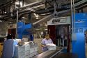 Mailroom workers bundle newspapers printed at the Houston Chronicle in Houston, Texas.