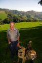 Basque shepherd with dogs and sheep grazing in the Baztan Valley of the Navarre region of northern Spain.
