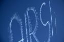 Small airplane sky writing over Boise, Idaho, USA.