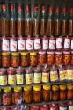 Vendor selling bottles of fish and shrimp sauces in the coastal town of Lang Co in Vietnam.