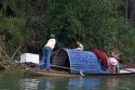 Vietnamese people travel by boat on the Perfume River at Hue, Vietnam.