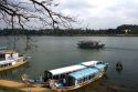 Tourist boats on the Perfume River in front of the Thien Mu Pagoda  in Hue, Vietnam.