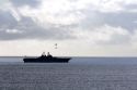 USS Bonhomme Richard Amphibious Assault Ship of the United States Navy being resupplied by helicopter in the Pacific Ocean near Camp Pendleton, California, USA.