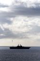 USS Bonhomme Richard Amphibious Assault Ship of the United States Navy being resupplied by helicopter in the Pacific Ocean near Camp Pendleton, California, USA.