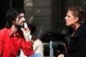 French man and woman have a conversation near the Sorbonne in Paris, France.