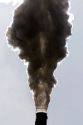 Industrial smokestack venting hot flue gases.