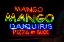 Neon sign advertising drinks and food in the French Quarter of New Orleans, Louisiana, USA.