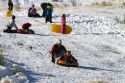 Sledding on a snowy hill near Boise, Idaho, USA.