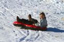 Sledding on a snowy hill near Boise, Idaho, USA.