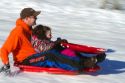 Sledding on a snowy hill near Boise, Idaho, USA.