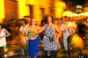 People parade and dance along Defensa street in the San Telmo barrio of Buenos Aires, Argentina.