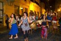 People parade and dance along Defensa street in the San Telmo barrio of Buenos Aires, Argentina.