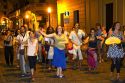 People parade and dance along Defensa street in the San Telmo barrio of Buenos Aires, Argentina.