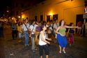 People parade and dance along Defensa street in the San Telmo barrio of Buenos Aires, Argentina.