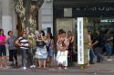 People wait at a bus stop in Buenos Aires, Argentina.