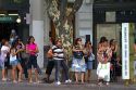 People wait at a bus stop in Buenos Aires, Argentina.