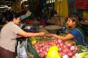 Vendor at a cooperative produce market in the Chorrillos district of Lima, Peru.