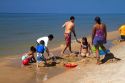 People on the beach at Little Sable Point Light on Lake Michigan in Golden Township, Michigan, USA.
